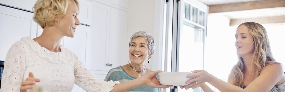 Multigenerational women in their kitchen.